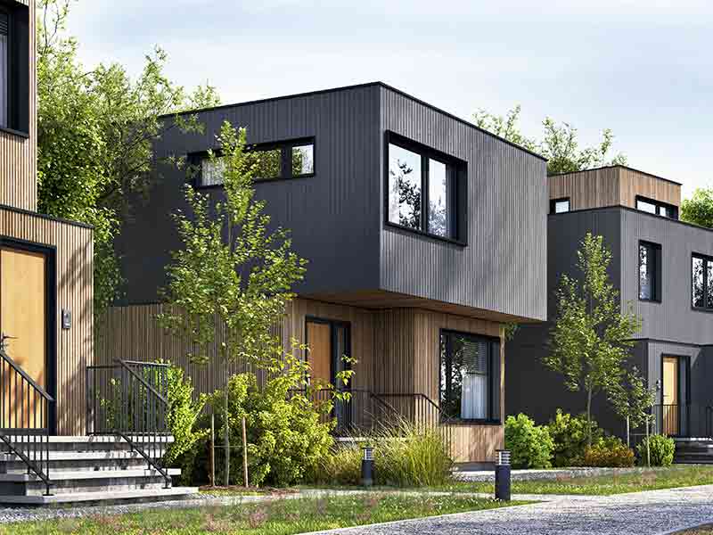Modernes Holzhaus mit Garten und Straße.